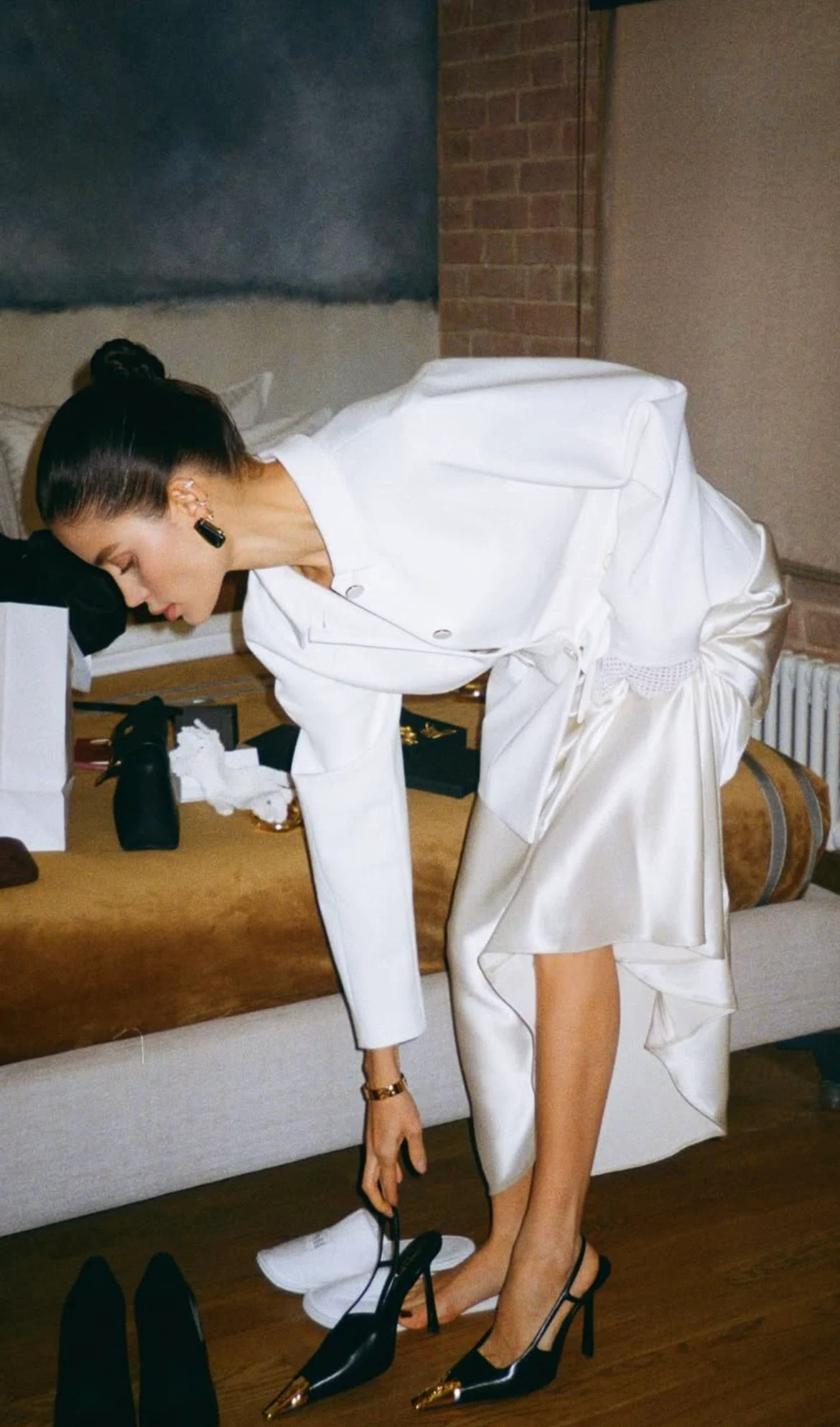 Stylist arranging a white event look